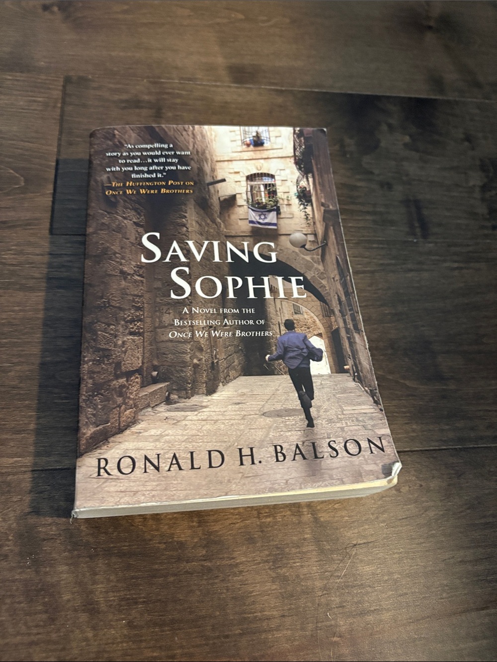 Ronald H. Balson "Saving Sophie" Paperback Book - Brown Cover